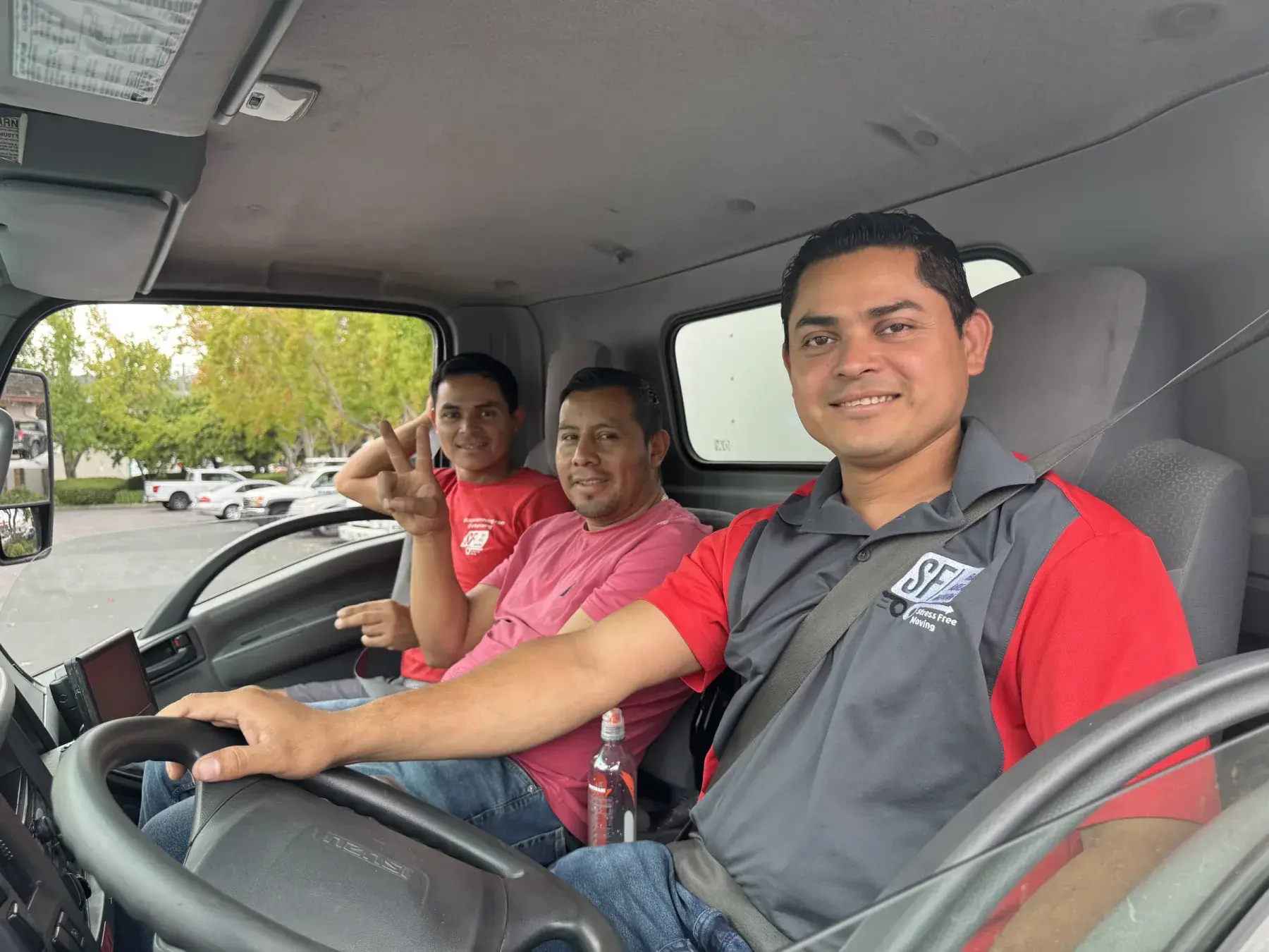 Members of the SF Bay Area Moving team inside a truck
